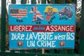 Protest banner against Julian Assange`s extradition gather outside Belmarsh Prison.