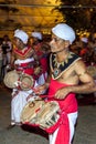 Thammattam Players perform in front of the Temple of the Sacred Tooth Relic in Kandy in Sri Lanka.