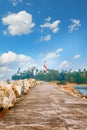 Thangassery Lighthouse on the cliff surrounded by palm trees and big sea waves on the Kollam beach. Kerala, India Royalty Free Stock Photo