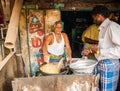 THANJAVOUR, INDIA - FEBRUARY 13: An unidentified Indian man fries in oil of national Indian food in rural cafe. India, Tamil Royalty Free Stock Photo