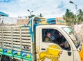 THANJAVOUR, INDIA - FEBRUARY 13: An unidentified Indian men riding in the colored freight car. India, Tamil Nadu, near Royalty Free Stock Photo