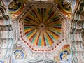 The ornate, colorfully painted ceiling of the ancient 17th century Maratha Palace in