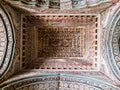 The ornate, colorfully painted ceiling of the ancient 17th century Maratha Palace in