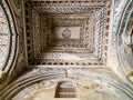 The ornate, colorfully painted ceiling of the ancient 17th century Maratha Palace in