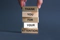 Thank you for attention symbol. Concept words Thank you for your attention on wooden blocks on a beautiful grey table grey