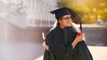 Thank you for being such a supportive friend. two university students hugging each other on graduation day.