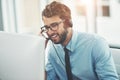 Thank you for calling. a happy young man working in a call center. Royalty Free Stock Photo