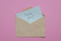 Thank you card inside brown envelope Royalty Free Stock Photo