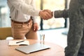 Thank you for coming to meet me. two unidentifiable business partners shaking hands over a table in the office. Royalty Free Stock Photo