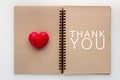 Thank you concept with Blank open notebook and red heart