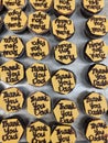 Thank you dad writing on a yellow colour chocolate decoration on top of a cupcake