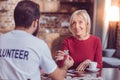 Attractive blonde woman taking puzzle