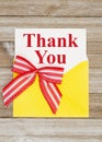 Thank you greeting card with yellow envelope on wood Royalty Free Stock Photo