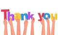 Thank you. A group of people hold big letters. Royalty Free Stock Photo