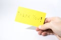 Thank you handwrite with a hand on a yellow paper