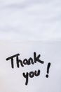 Thank you handwriting text close up isolated on white paper with copy space. Writing text on memo post reminder Royalty Free Stock Photo