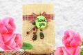 Thank you letter tag or label with flower and jute bag