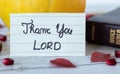 Thank You Lord God Jesus Christ. Handwritten religious text quote inspiring message with closed Holy Bible, and fall fruits