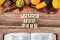 Thank You LORD wooden cubes with handwritten letters on wooden table with open Holy Bible Book. Thanksgiving concept.