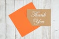 Thank you brown greeting card with envelope on textured weathered whitewash wood Royalty Free Stock Photo