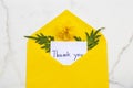 Thank you message card handwriting in envelope and yellow flowers cosmos Royalty Free Stock Photo