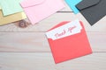 Thank you message and envelope on wooden table Royalty Free Stock Photo