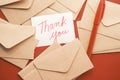 thank you message and envelope on wooden table Royalty Free Stock Photo