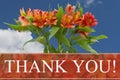 Thank You message with a orange and yellow lilies bouquet