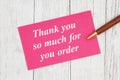 Thank you so much for your order text on pink card with pen