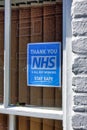 A Thank You NHS & All Key Workers Sign in a house window