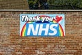 A Thank You NHS banner attached to a brick wall