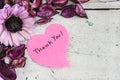 Thank you note in heart shape paper with pink flowers