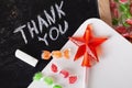 Thank you Space written on a blackboard with chalk, caramel, candy, star, wand, valentines day, sweet tooth lollipop Royalty Free Stock Photo