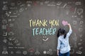 Thank You Teacher greeting for World teacher\'s day concept with school student back view drawing doodle Royalty Free Stock Photo