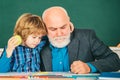 Thank You Teacher. Individual teaching. Teacher with male elementary school pupil with problem. Professor and pupil in Royalty Free Stock Photo