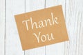 Thank you text on a brown greeting card Royalty Free Stock Photo