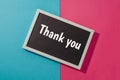 Thank you - text on chalkboard on blue and pink