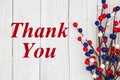 Thank you text with red, white and blue berry spray