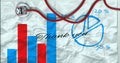 Thank you text and stethoscope over statistical data on crumbled paper