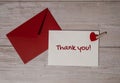 THANK YOU text on valentine card inscription positive quote phrase Greeting card with red envelope on wooden background Royalty Free Stock Photo