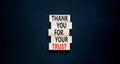 Thank you for trust symbol. Concept words Thank you for your trust on wooden blocks on a beautiful black table black background. Royalty Free Stock Photo