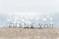 Thank you word drawn on the beach sand Royalty Free Stock Photo