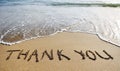Thank you word drawn on the beach sand Royalty Free Stock Photo