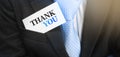 Thank you words on a card in businessman`s pocket. Business concept