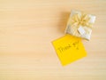 Thank you words on sticky note with gift box Royalty Free Stock Photo