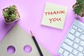 Thank you written on sticky notes on modern desk Royalty Free Stock Photo