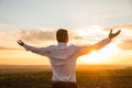 Thankful Businessman with Open Arms at the Field on sunset. Royalty Free Stock Photo