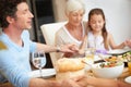 Thankful for family time and great food. a family praying together before having a meal. Royalty Free Stock Photo