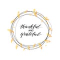 Thankful and grateful text in autumn wreath