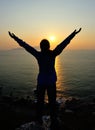 Thankful woman open arms to the sunrise Royalty Free Stock Photo